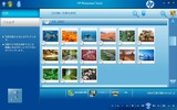HP Photosmart Touch画面。写真をタッチすると拡大表示、スライドショーを見るには右上のアイコンをタッチするの画像