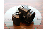 　松下電器産業は、LUMIXシリーズの新製品として、光学12倍ズームと手ブレ補正機能を搭載した500万画素デジタルカメラ「DMC-FZ20」を8月27日に発売する。価格はオープンで、実売予想価格は73,000円前後（税込み）。の画像