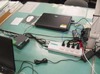 富士通、スマートコンセントで横浜市のPC消費電力量の「見える化」を実施