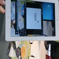COCOAR：マーカーとして設定したチラシをアプリで読み取るとサービス紹介の動画が再生される。2013 Japan IT Week（2013年5月）