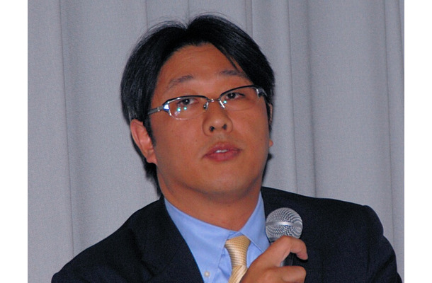 J：COMの通信事業戦略部長である阿賀谷匡章氏