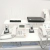 パナソニックのブースでは無線LAN機能付き携帯電話を内線電話として利用する事例の展示が行われていたの画像