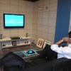 クレードルを通して液晶テレビに接続。Bluetoothキーボードを接続すればデスクトップPC同様に家庭でも使用できるの画像