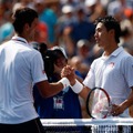 ジョコビッチ（背中）と錦織（9月6日）　(c) Getty Images