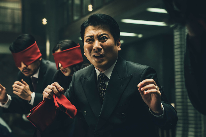 映画『バラサイト 半地下の家族』でも印象的だったミョンフンは、本作でも強烈な個性を発揮していた。／Netflixシリーズ『ペーパー・ハウス・コリア: 統一通貨を奪え』独占配信中