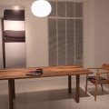 「ふしとカケラMARUNI COLLECTION HIROSHIMA with minä perhonen」端材を使った無垢天板のテーブル「MALTA」とその上に、スペシャルバッグ。椅子は、パッチワークのファブリックを座面に施したスペシャルチェア