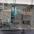 「マルチメディアポートSギガ（光コンセント付き）」。左から電話線の分岐とLANの差し込み口、スイッチングハブ、テレビ放送波の分波器