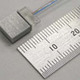 富士通、従来品の1/10以下のサイズの高速計算ノード相互接続用超小型光リンクモジュール技術を開発 画像