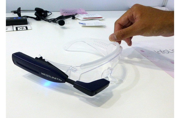 本体はクリップでメガネに固定でき、画像は透明なゴーグル（オーバーグラスマウンター）に着用した例（撮影：防犯システム取材班）