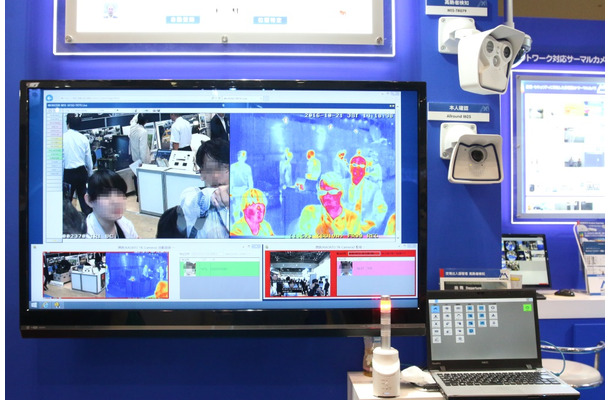 パンデミックの水際対策として提案されていたMOBOTIX JAPANのサーマル対応カメラ「M15」シリーズをはじめとする各種ネットワークカメラと、NECの顔認証ソリューション「顔跡/KAOATO」を組み合わせた展示（撮影：防犯システム取材班）